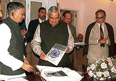 Prime Minister Atal Bihari Vajpayee releasing the "India Rural Development Report-1999" at his residence in New Delhi on Monday. Union Rural Development Minister Sundarlal Patwa and Union Urban Development Minister Jagmohan are also seen in the picture
