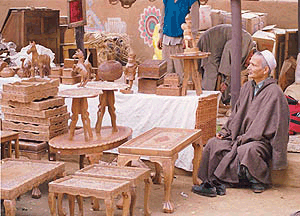 A Kashmiri craftman sits with his items at the Surajkund Craft Fair on Wednesday. This year's theme is Jammu & Kashmir  Photo by Sandeep Shankar