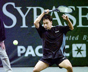 Michael Chang, of Mercer Island, Wash., returns a shot to Paradorn Srichaphan of Bangkok, Thailand in the first set of their Sybase Open match in San Jose, Calif., Tuesday night