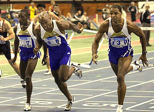 Cuba's Anier Garcia (right) USA's Tony Dees (centre) and Cuba's Yoel Hernandez, cross the finish line during the 60 meters hurdles final of the "ATHINA 2000" indoor track and field meeting in Athens on Wednesday. Garcia wins with 7.37 seconds