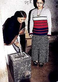 Bihar Chief Minister Rabri Devi casting her vote with her daughter Misa Bharati at booth no. 358 in the Veternary Campus on Saturday