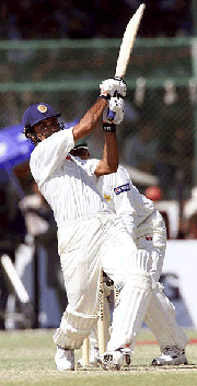 Marvan Atapattu, 119 notout, of Sri Lanka plays boundary off Wasim Akram of Pakistan, in the National stadium in Karachi on Sunday. Sri Lanka scored 274 against Pakistan in the first one-day test series
