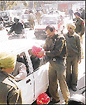 Vehicles queue up for checking on the PU campus in Chandigarh on Monday