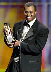 Tiger Woods receives the award for Golf Athlete of the Decade during the ESPY Awards at the MGM Grand in Las Vegas on Monday