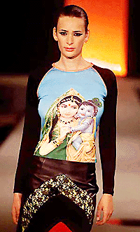 A model wears a top, with an Indian motif, designed by Matthew Williamson on the second day of London fashion week, on Monday. Williamson is showing his Autumn/Winter 2000 designs. London Fashion week continues till Thursday 