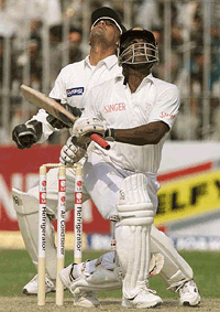 Sri Lankan captain Sanath Jayasuriya, right, edges Pakistan off-spinner Saqlain Mushtaq as wicketkeeper Moin Khan watches the ball in the second one-day international, at Jinnah Stadium in Guranwala, on Wednesday. 