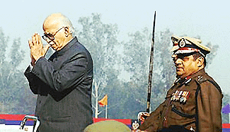 Union Home Minister L.K. Advani greets police personnel at the Delhi Police Raising Day parade in New Delhi on Wednesday. Ajai Raj Sharma, Police Commissioner of Delhi, is standing behind hm. 