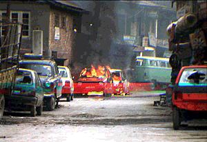 Two Maruti cars in flames following a militant attack in Badshah chowk area of Srinagar on Wednesday
