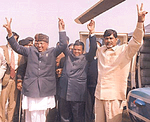 Andhra Pradesh Chief Minister Chandrababu Naidu (right) and Haryana Chief Minister Om Prakash Chautala hold the hands of candidate Nafe Singh during campaigning for the Bahadurgarh seat on Thursday