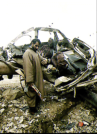 A counter- insurgent looking at the crater caused by land-mind explosion which blew up the vehicle of Ikhwan chief, Fayaz Ahmad Mir at Rakh-e-Asham in north Kashmir on Thursday. Fayaz and his close associate were killed and two of his bodyguards were injured in the explosion triggered by militants