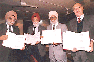 The Chief Election Commissioner Dr. M.S Gill releasing a French translation of The Sikh Holy book Guru Granth Sahib translated by a Toronto based academician  Dr. Jarnail Singh ( second from right) at Bhai Vir Singh Sadan in New Delhi on Monday. Also in photograph are the French Cultural Secretary in New Delhi Dr. Jean Marie Lafont (extreme right) and Sikh historian Dr J.S Neki (extreme left). Photograph by: Sondeep Shankar/ Saab Press