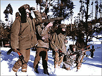 An Army column maintains vigil on a suspected infiltration route near the LoC in Kupwara sector of North Kashmir.  PTI 