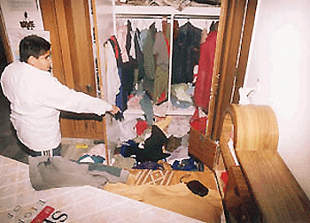 Amit Dogra points out to the cupboard which was ransacked after an unidentified robbber tied up his mother and decamped with valuables in Sector 38, Chandigarh, on Tuesday. 