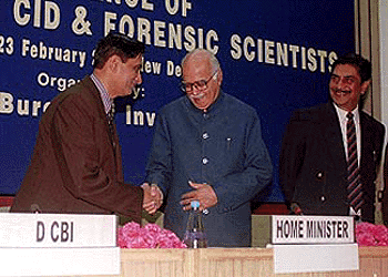 Union Home Minister L. K. Advani being received by CBI Director Raghavan while Cabinet Secretary Prabhat Kumar looks on at the conference on DsGP, Chiefs of CID and Forensic Scientists at a function in New Delhi on Tuesday