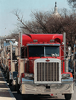 With the Capitol in the background, truckers form a long line in Washington on Tuesday, during a protest against skyrocketing diesel fuel prices. More than 200 truckers participated in the protest which started in New Jersey and travelled through Delaware and Maryland before winding through Washington.