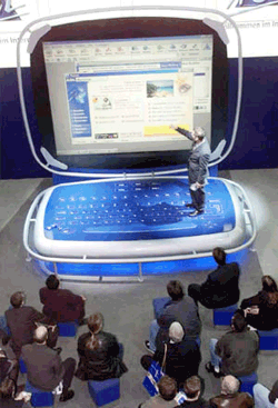 Visitors watch a software demonstration at the AOL booth at the Cebit fair in Hanover, northern Germany on Thursday