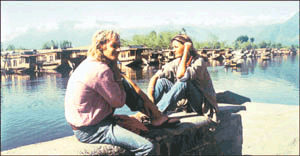 A foreign couple enjoys a siesta on the Dal Lake embankment despite an increase in militancy-related violence