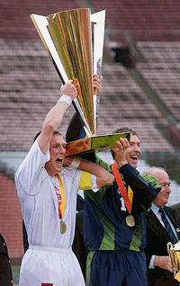 Canada's captain Jason deVos (left) and goalie Craig Forrest hold up the Gold Cup trophy after beating Colombia 2-0 in the final in Los Angeles on Sunday. 