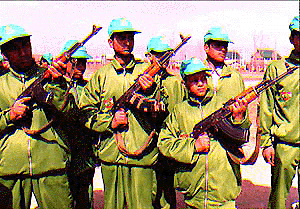 Kashmiri schoolchildren with guns, belonging to Army personnel, on Wednesday, before proceeding for an Indian Army-sponsored goodwill tour. 