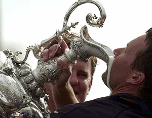 Team New Zealand's Warwick Fleury drinks from the America's Cup after New Zealand defeated Italy's Luna Rossa for the oldest sporting trophy in the world in Auckland on Thursday. New Zealand had a clean sweep winning in 5 straight races to retain the cup.