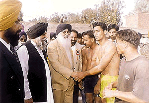 Mr Parkash Singh Badal, Chief Minister of Punjab, is introduced to players at the International Kabaddi Tournament at Zirakpur on Sunday.  A Tribune photograph
