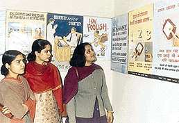 Visitors having a look at posters displayed at an AIDS seminar in Government Medical College, Patiala on Sunday