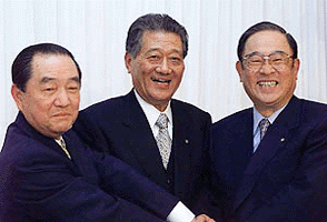 Toyota Motor Co. President Fujio Cho, right, shares a smile with Yamaha Motor Co. President Takehiko Hasegawa, centre, and Yamaha Corporation President Kazukiyo Ishimura during their joint press conference on their tie-up in Tokyo Monday. Toyota, Japan's largest automaker that plans to enter Formula One racing as early as 2001, announced it will buy a 5 percent stake in Yamaha Motor, the world's second-largest motorcycle maker, to co-develope auto racing projects with Yamaha, as well as design and build automobile engines. 