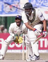 Sri Lankan wicketkeeper Romesh Kaluwitharana, left, successfully appeals for the dismissal of Pakistani batsman Inzamamul Haq, right, on the fourth day of the second cricket Test, Wednesday, at Arbab Niaz Stadium in Peshawar
