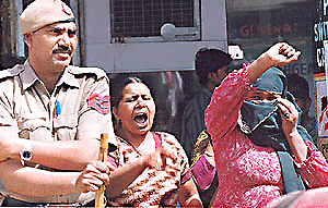A brothel-keeper in Delhis G.B. Road area shouts at women activists belonging to the Nari Raksha Samiti who were taking out a procession to mark International Womens Day on Wednesday. The processionists were shouting slogans exhorting sex workers to give up their trade.