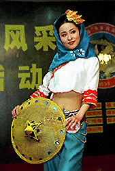 Wu Xiaojun, winner of Huian Beauty Contest, performs in the final show, in Xiamen, China. This is the first time a beauty contest was held for Huian women, in which some 100 women participated. Huian are famous for their costumes.