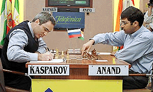 World leading chess player Garry Kasparov (left), writes down his move as Viswanathan Anand makes his first move during Grandmaster Chess Tournament in Linares, southern Spain on Friday. Kasparov and Vladimir Kranmik tied for first place after the tenth and last round on Friday.  AP/PTI