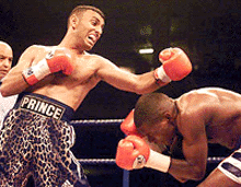 Britain's Prince Naseem Hamed (left) fails to connect against Vuyani Bungu of South Africa in their WBO Featherweight Title contest at Olympia, in London on Saturday