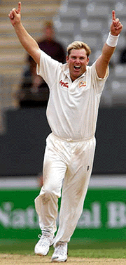 Australian spinner Shane Warne celebrates capturing the wicket of New Zealand batsman Craig McMillan