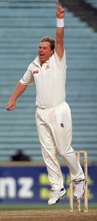 Australian spin bowler Shane Warne celebrates after taking the wicket of New Zealand batsman Nathan Astle for 35 in the first test match in Auckland, New Zealand on Monday. The wicket gave Warne 355 test victims, joining Dennis Lillee as Australia's most successful test bowler
