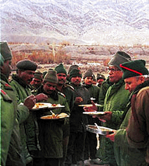 Defence Minister George Fernandes interacts with troops at a forward post in Leh sector on Sunday