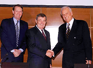    TURIN : General Motors president John F. Smith, center, shakes hands with Fiat president Paolo Fresco, right, as General Motors managing director Richard Wagoner looks on at the end of a press conference they held at the Fiat headquarters in Turin, northern Italy, on Monday. Italy's Fiat auto dynasty and U.S. automaker General Motors Corp. announced a historic alliance expected to open up international markets for both the auto giants. Fiat and GM officials said the deal is a share swap giving GM 20 percent of Fiat Auto and Fiat 5.1 percent of GM. AP/PTI
