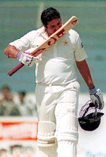 Pakistan's Inzamam ul Haq who scored 138 against Sri Lanka, kisses his bat, at National Stadium in Karachi on Tuesda