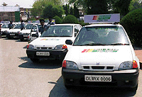 Luxury radio cabs which hit the Capital's roads on Wednesday being displayed at the national stadium's ground in New Delhi on Wednesday 
