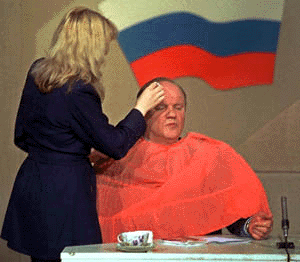 A makeup artist prepares Communist Party chief Gennady Zyuganov for a television interview during a presidential campaign tour in the Ural Mountains city of Chelyabinsk, Thursday. Zyuganov, who is expected to come in second in the March 26 elections, appealed to the youth vote during the tour, since most of his electorate is retires