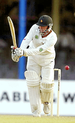 Andy Flower of Zimbabwe bats against the West Indies during the second day of the first test match at the Queen's Park Oval in Port-of-Spain, Trinidad Friday. At the end of play Friday Flower was not out for 52