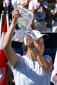 Lindsay Davenport, from Newport Beach, Calif., holds up her trophy after defeating Martina Hingis, from Switzerland, during the women's championship game of Indian Wells Tennis Masters Series in Indian Wells, Calif., at Tennis Gardens on Sunday.