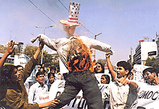 CPI (ML) activists burn an effigy of US President Bill Clinton in New Delhi on Sunday