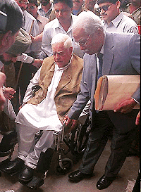 Win Chadha, a key accused in Bofors kickback case, being taken to Tis Hazari courts on a wheelchair to stand trial in the case on Tuesday.  PTI 