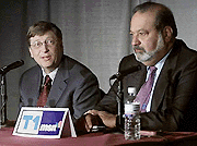 ill Gates, left, Chairman of Microsoft Corp. speaks along with Carlos Slim, chairman,Telmex. The two announced the formation of, T1msn, a Spanish language Internet portal. 