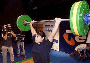 Caroline Pileggi, reigning Australian record holder in 75+kg classes, performs a 90 kg clean and jerk lift while training for the International Weightlifting Challenge in Sydney on Wednesday