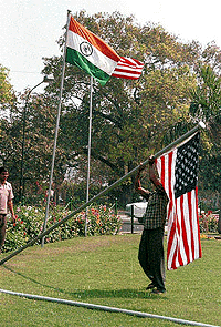 American flag being removed by a civic worker near the Teen Murti in New Delhi on Friday