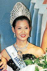 Kultida Yenprasert (21) smiles after winning the Miss Thailand contest in Bangkok on Friday