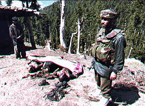 Charred bodies of three of the five militants suspected to be behind the massacre of 35 Sikhs at Chittisinghpora, wrapped under a white blanket in Kashmir on Saturday