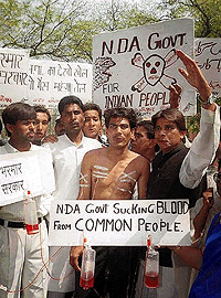 Human Rights Council activists demonstrate against the price hike in New Delhi on Sunday.  Photo by Saab Press