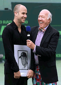 Andre Agassi (left) and tennis commentator Bud Collins share a laugh during the Ericsson Open at Key Biscayne on Saturday